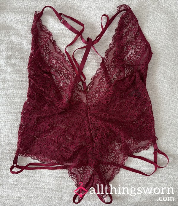 (1) Available. Berry Red One-Piece Crotchless.