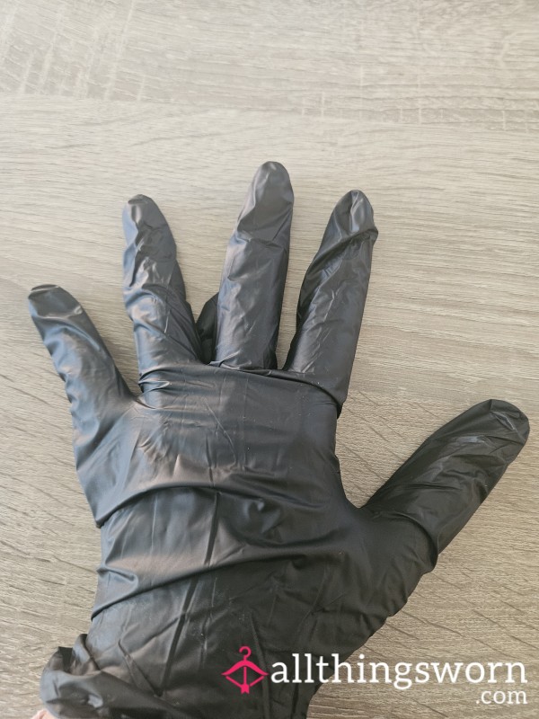 1 Pair Of Black Latex Gloves Used