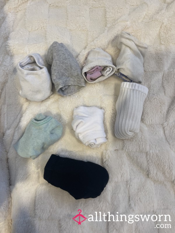 8 Sets Of Well Worn Socks .