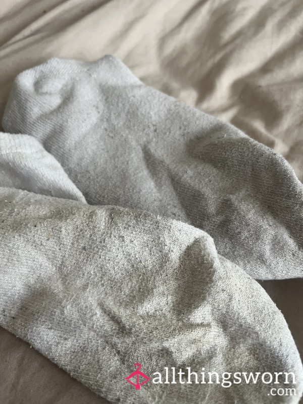 A Pair Of Well-worn White Ankle Socks
