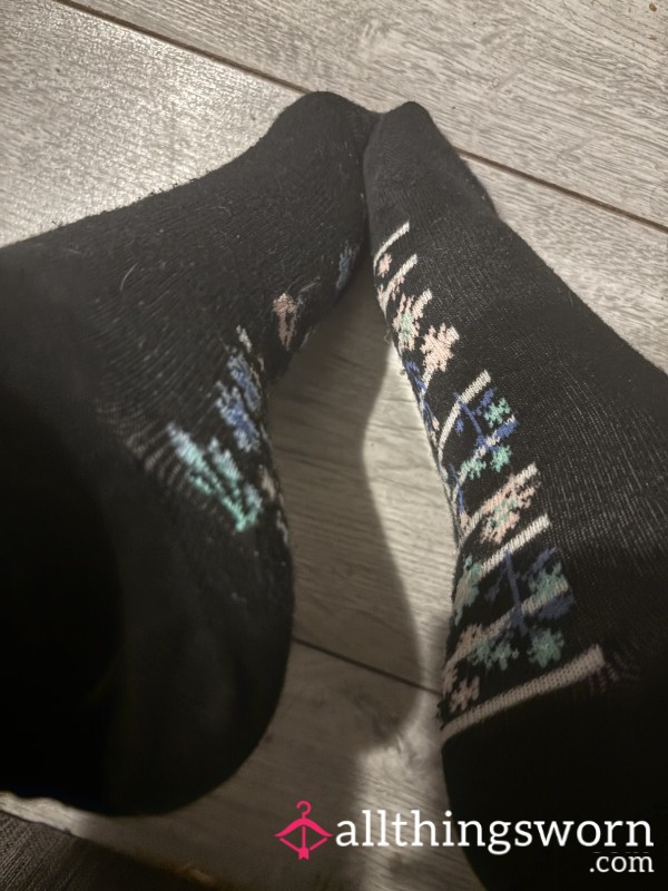 Black Ankle Socks With A Cute Colorful Flower Pattern Along The Sides