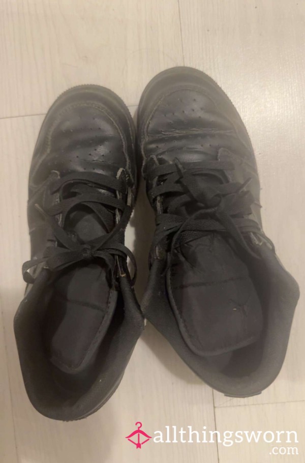Black & Battered” – Worn Out Nike Trainers