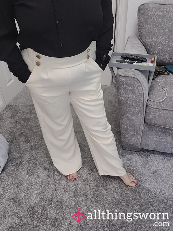 Black Blouse And White Trousers