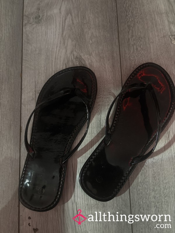 Black Flip Flops That Have Been Walked In Spain And Portugal