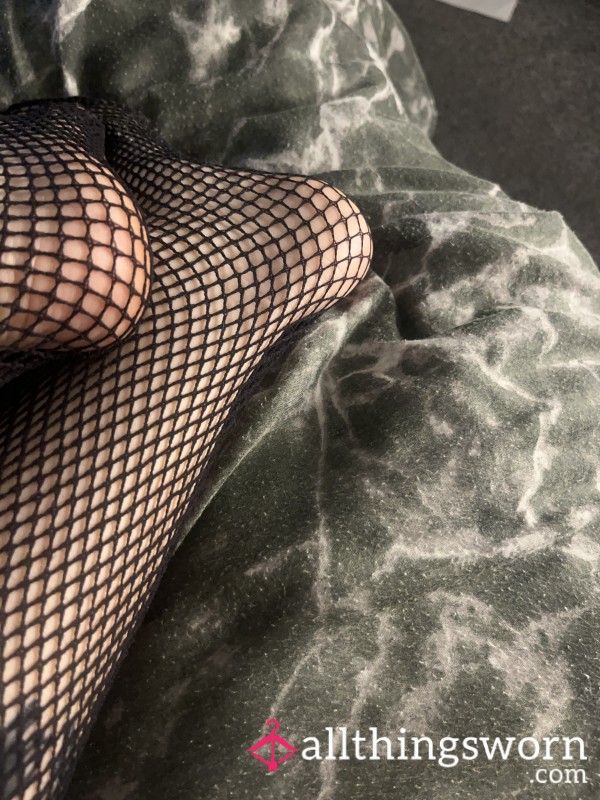 Black Painted Toes In Pretty Fishnet Stockings
