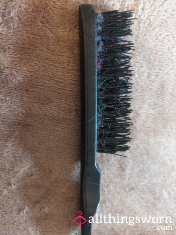 Black Teasing Comb With Different Coloured Hair Attached