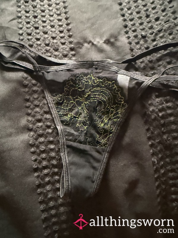 Black Thong With Gold Embellishments