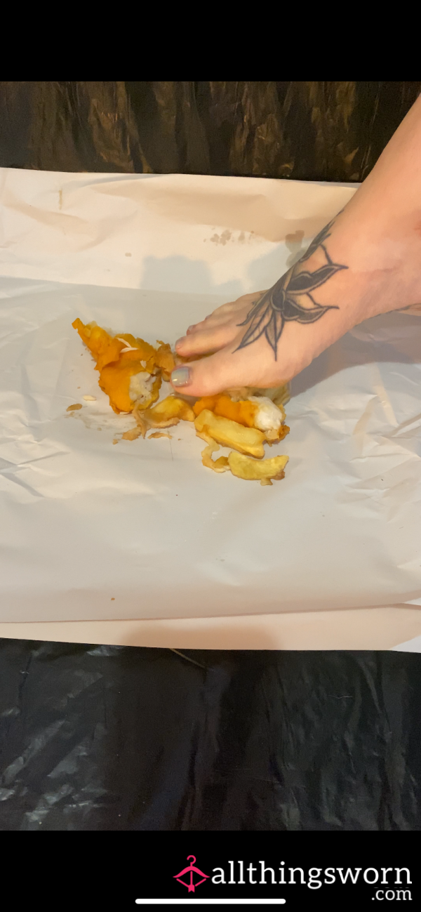 Chips, Cheese And Gravy With Fish Squished Between Toes