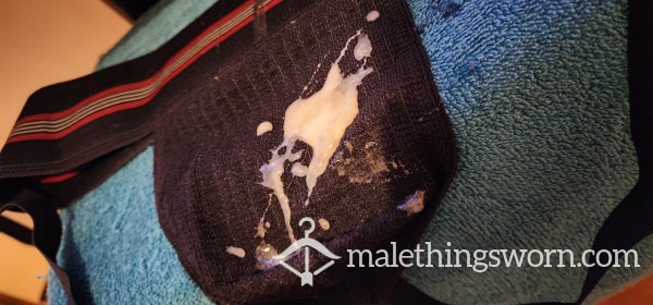 Cut C*ck Filling A Jockstrap With C*m