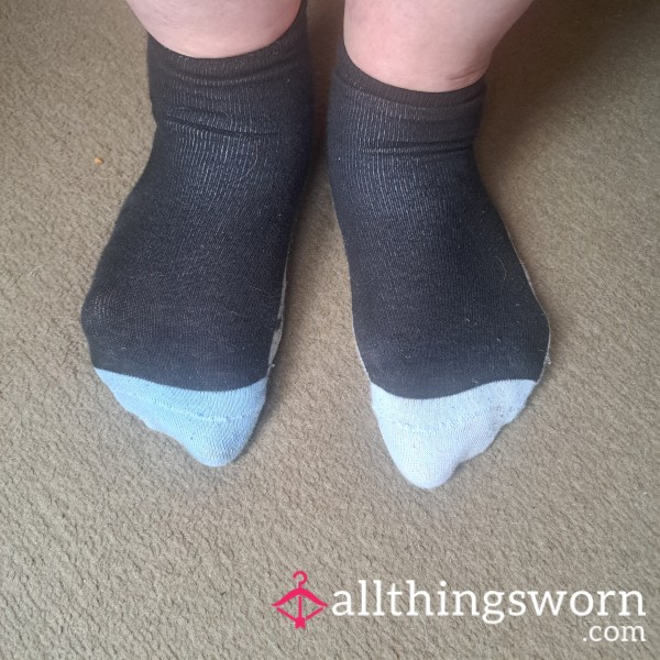 Dirty, Odd Socks With Puppy Patterned Soles