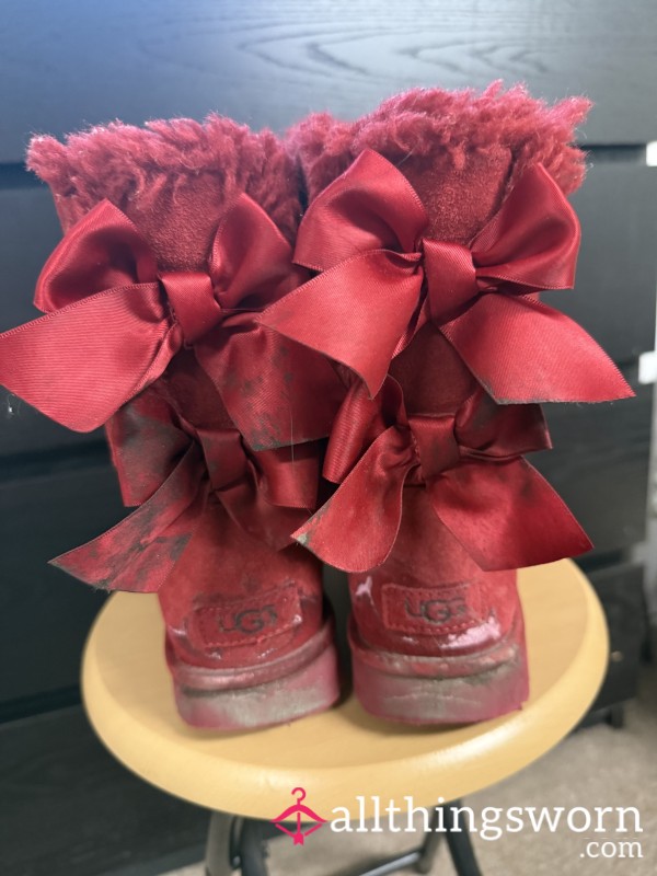 Dirty Red Ugg Boots With Ribbon Bows.