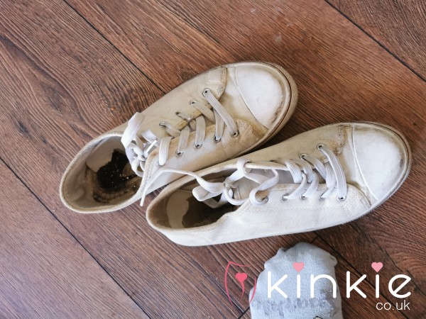 Extremely Well Worn And Stinky White Shoes
