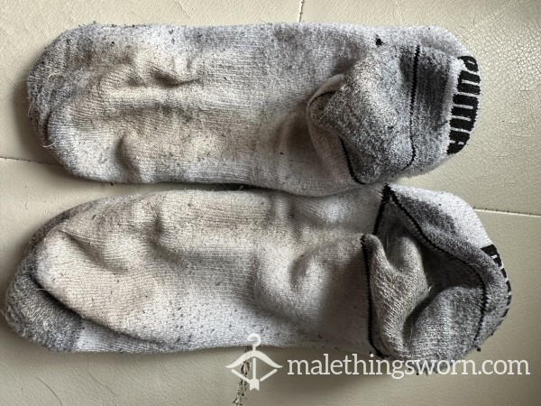 Extremely Worn White Puma Socks