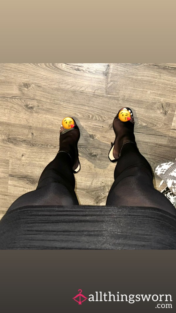 Feet Covered In Black Stockings