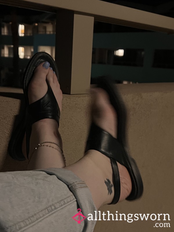 Feet In Leather Sandals