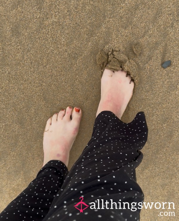 Feet In The Sand At The Beach