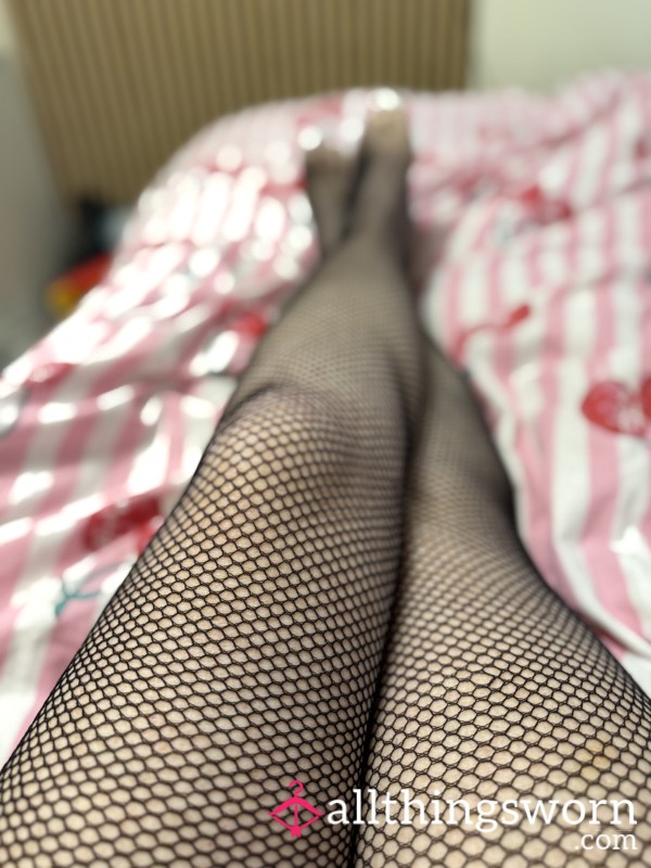 Feet Play In Fishnets