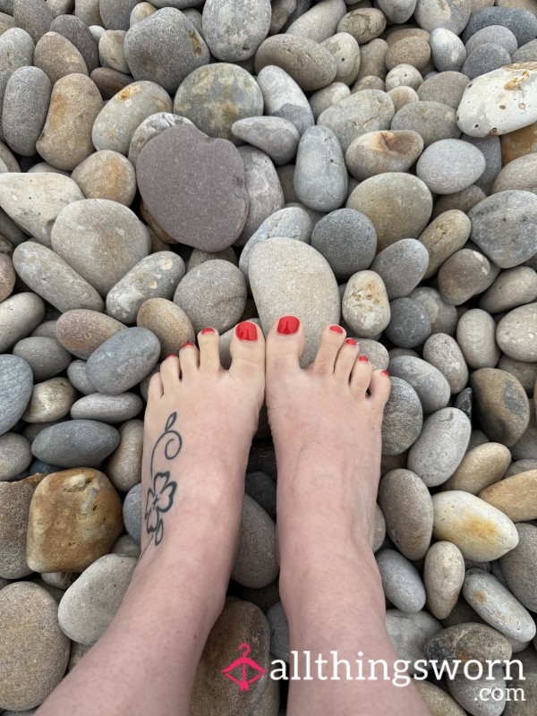 Foot Content Playing With The Pebbles