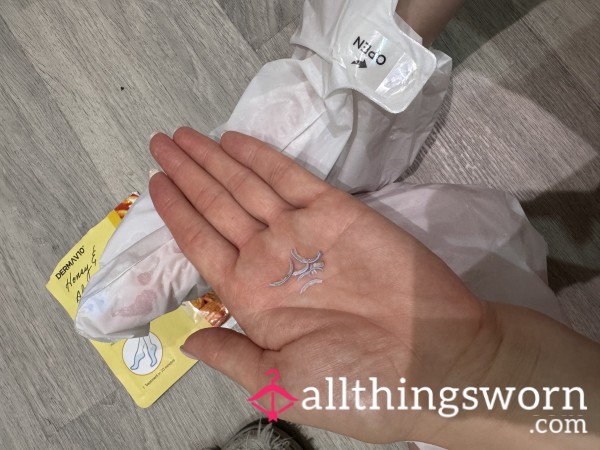 Used Foot Mask And Toe Nail Clippings