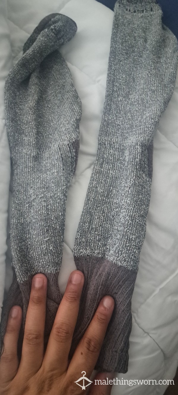 Grey Worn Socks After A Long Day.