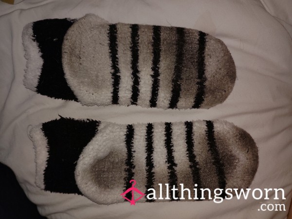 Heavy Use, Well Worn Penguin Pattern Fuzzy Socks. Footprint