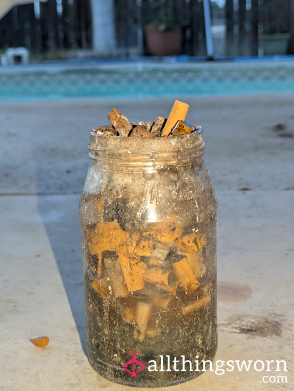 Jar Filled With Puffd Cigarette Bu*ts & Sp*t