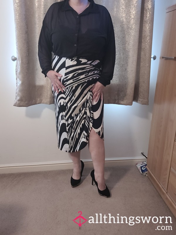 Knee Length Skirt And Black Blouse