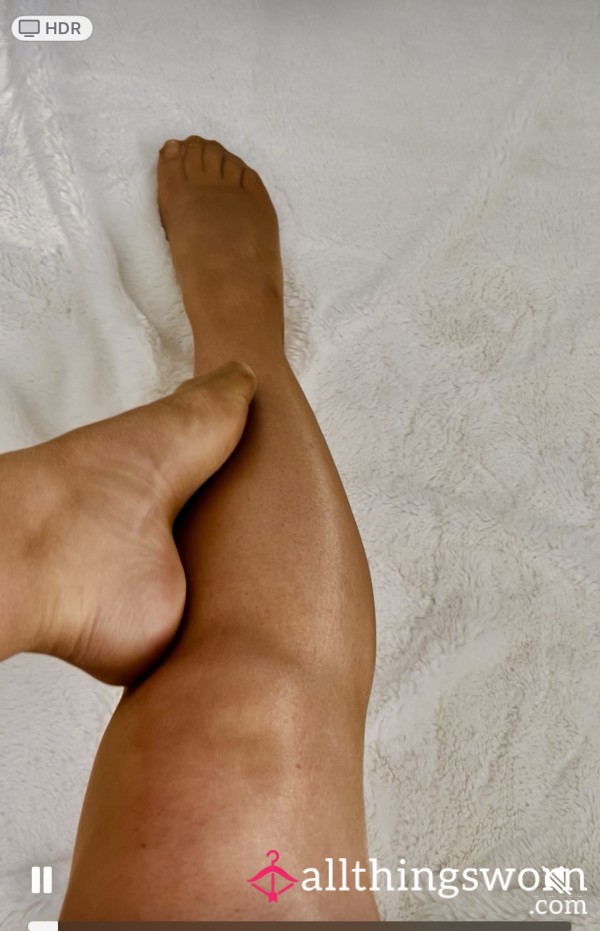 Leg And Foot Rubbing Together In Glossy Tights With Tight Pulling