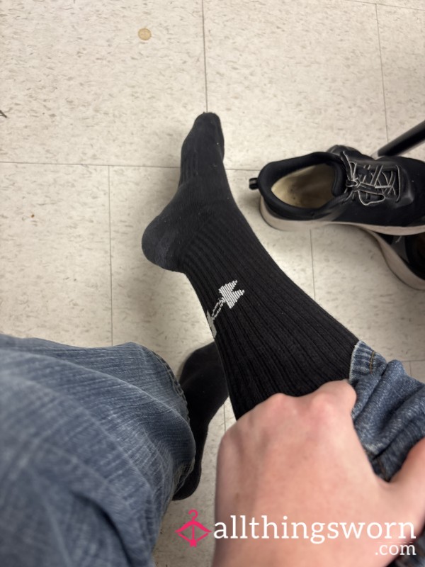 Long Black Socks Worn On Small Feet