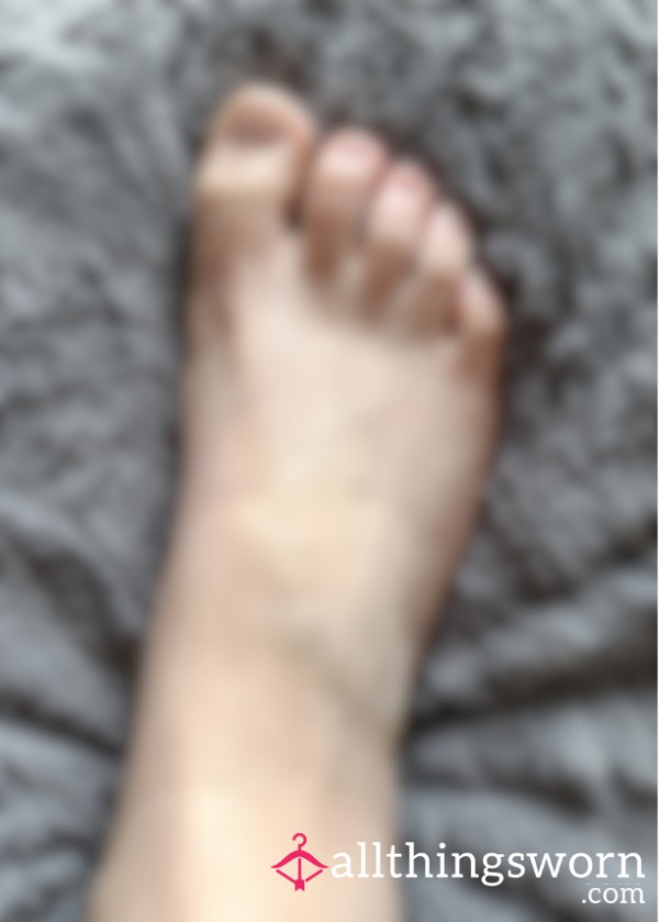 Lotion Rubbing Into Foot