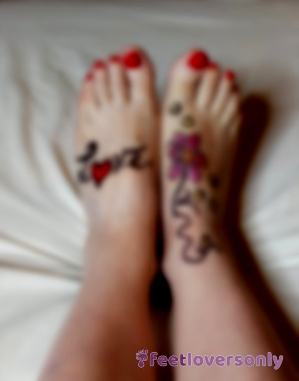 My Feet With The Word Love And A Flower Drawn.