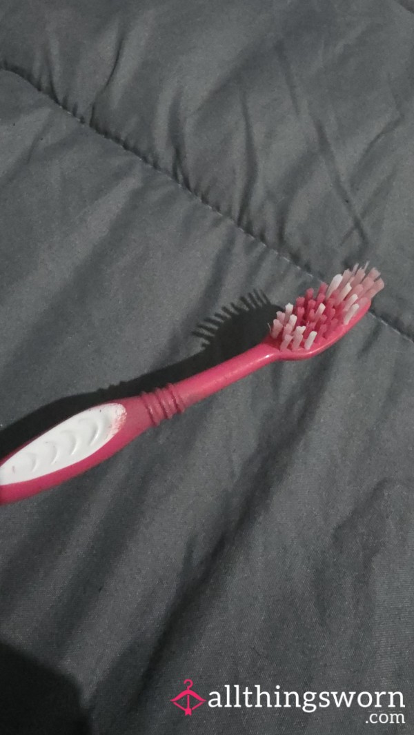 Used Toothbrush With Lipstick Mark