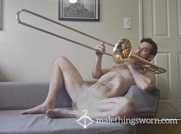 Naked With A Trombone On The Couch