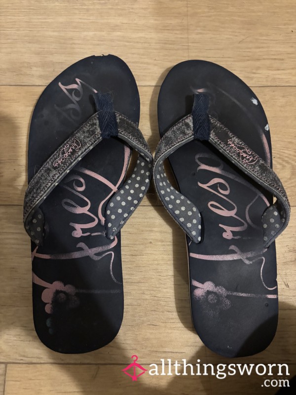 Navy And Pink Flip Flops Well Worn.