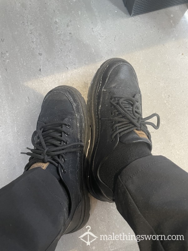 Old Black Leather Shoes That Have Been Worn For A Long Time