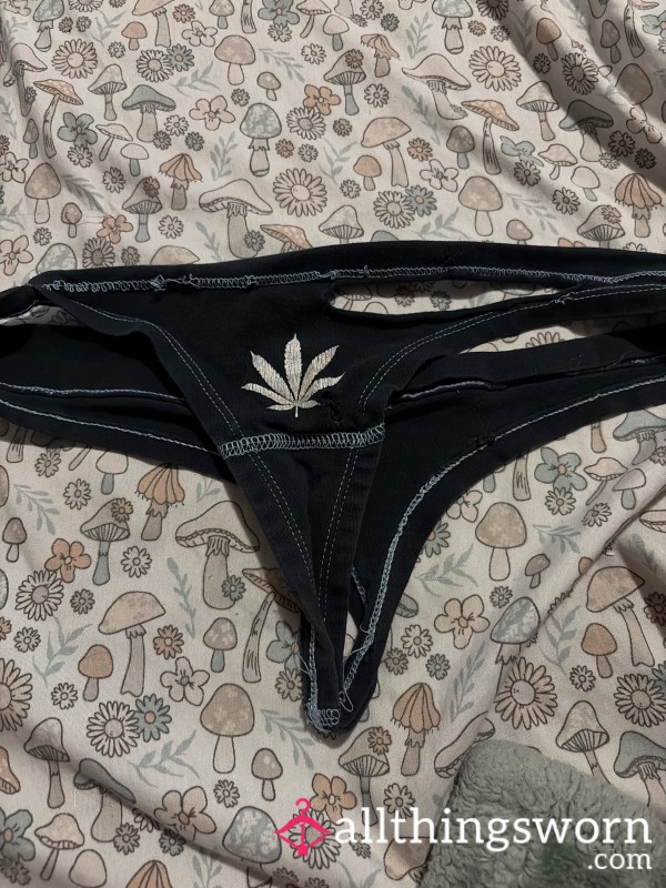 Old Very Used Black Thong With Rips And Holes