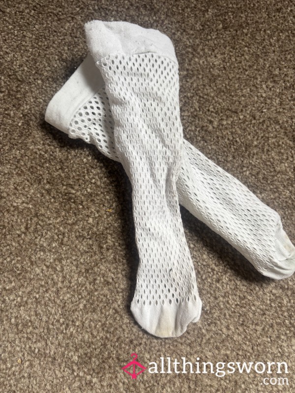 Old Worn And Stained Fishnet Socks