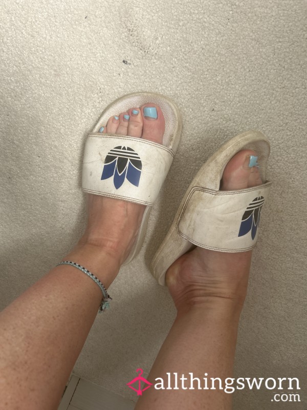 Pair Of Very Worn White Adidas Sliders
