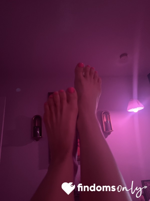 Pink Painted Toes In Pink Bed