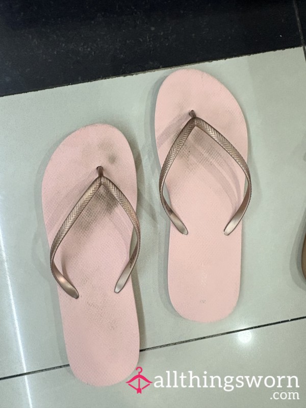 Pink Worn Flip Flops With Toe Prints