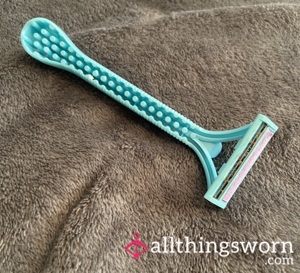 Razor With My Hairs Still Stuck On The Blade