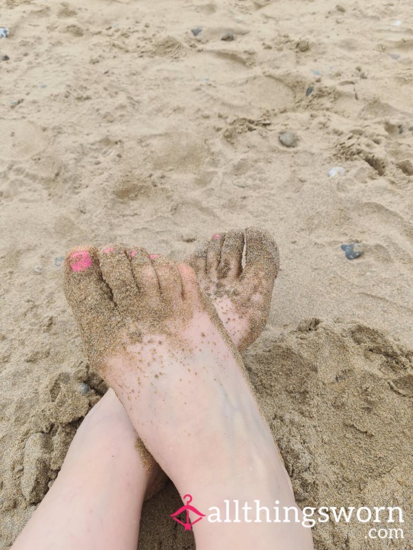 Sandy Feet And Pink Polished Toes