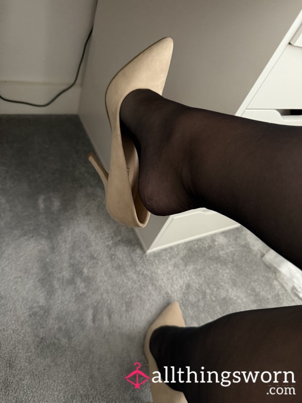 Shoe Dangling With Black Tights On