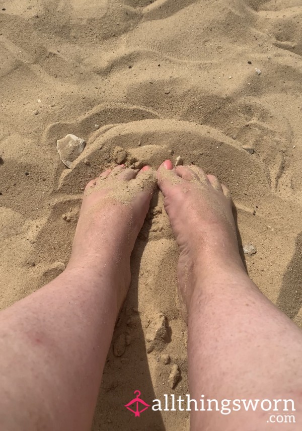 Size 5 Feet Playing In The Sand On The Beach