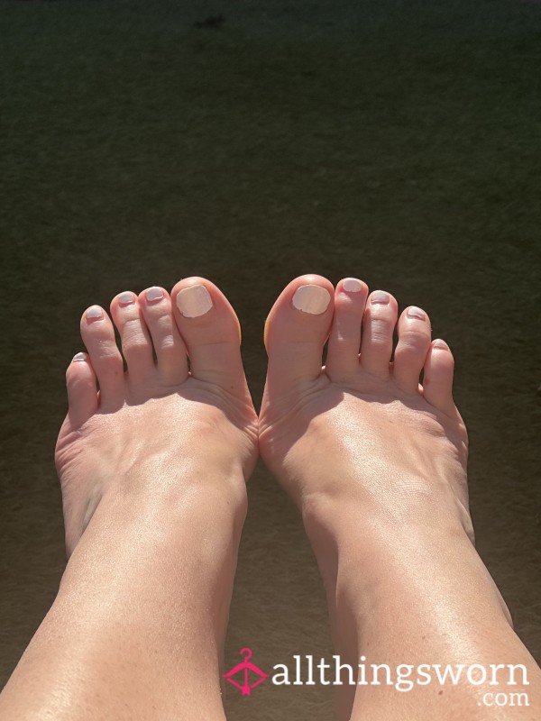 Slippers And Sunlit Feet