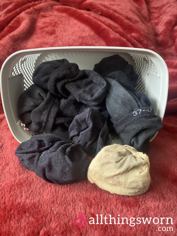 Smelly Black Socks And One Pair Of Footies.