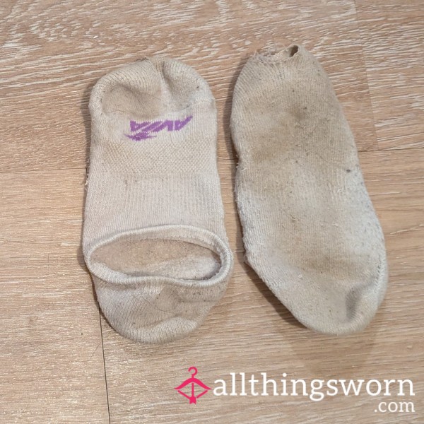 Smelly, Dirty, Worn Out White Socks - One With A Hole, One Getting Threadbare