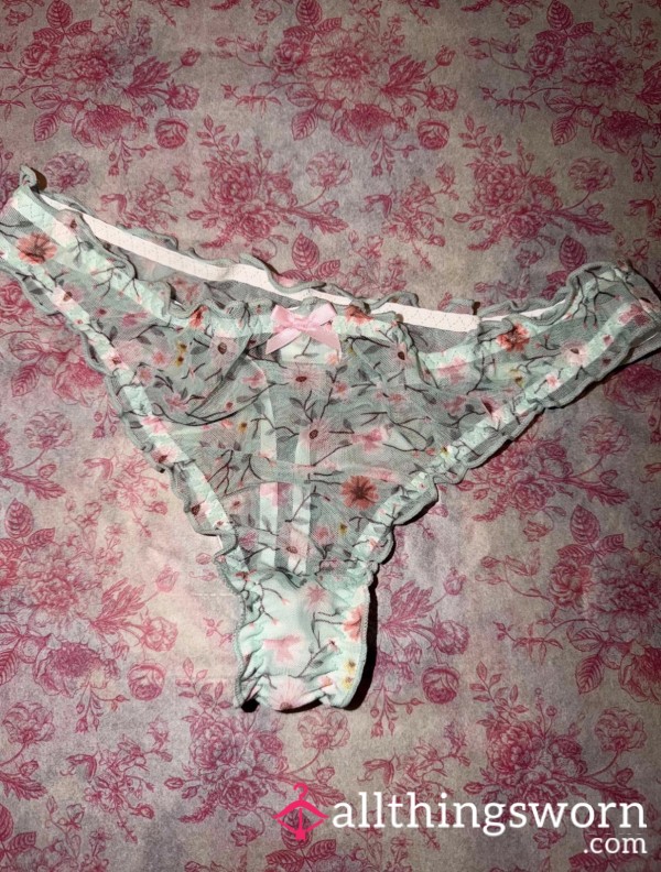 Soft Mint Mesh, Dusted With Tiny Blossoms And Finished With A Sweet Pink Bow At The Center