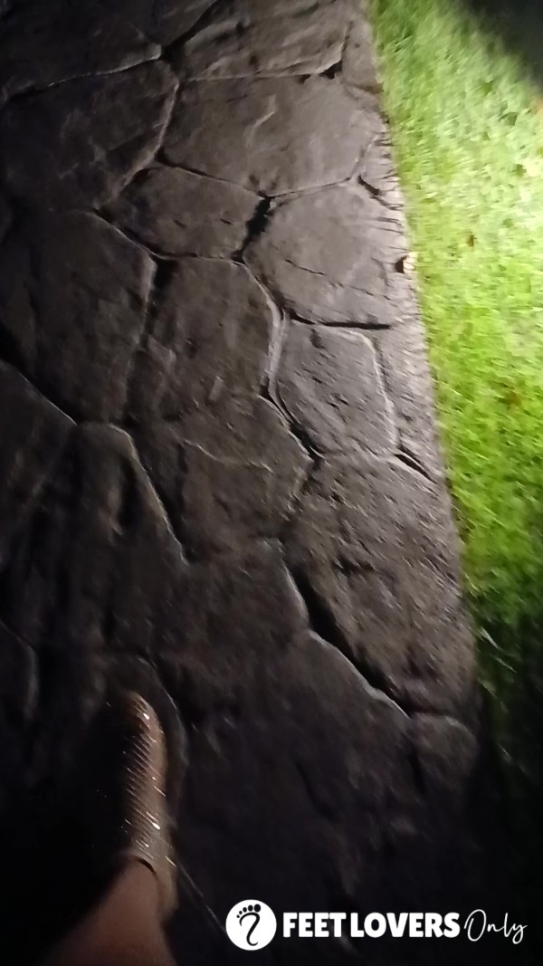 Sparkling Feet Night Walking A Dimly Lit Cobblestone Path In The Dominican Republic