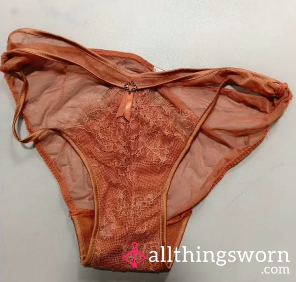 The Orange Underwear Of A Beautiful Young Woman Represents The Hidden Heat